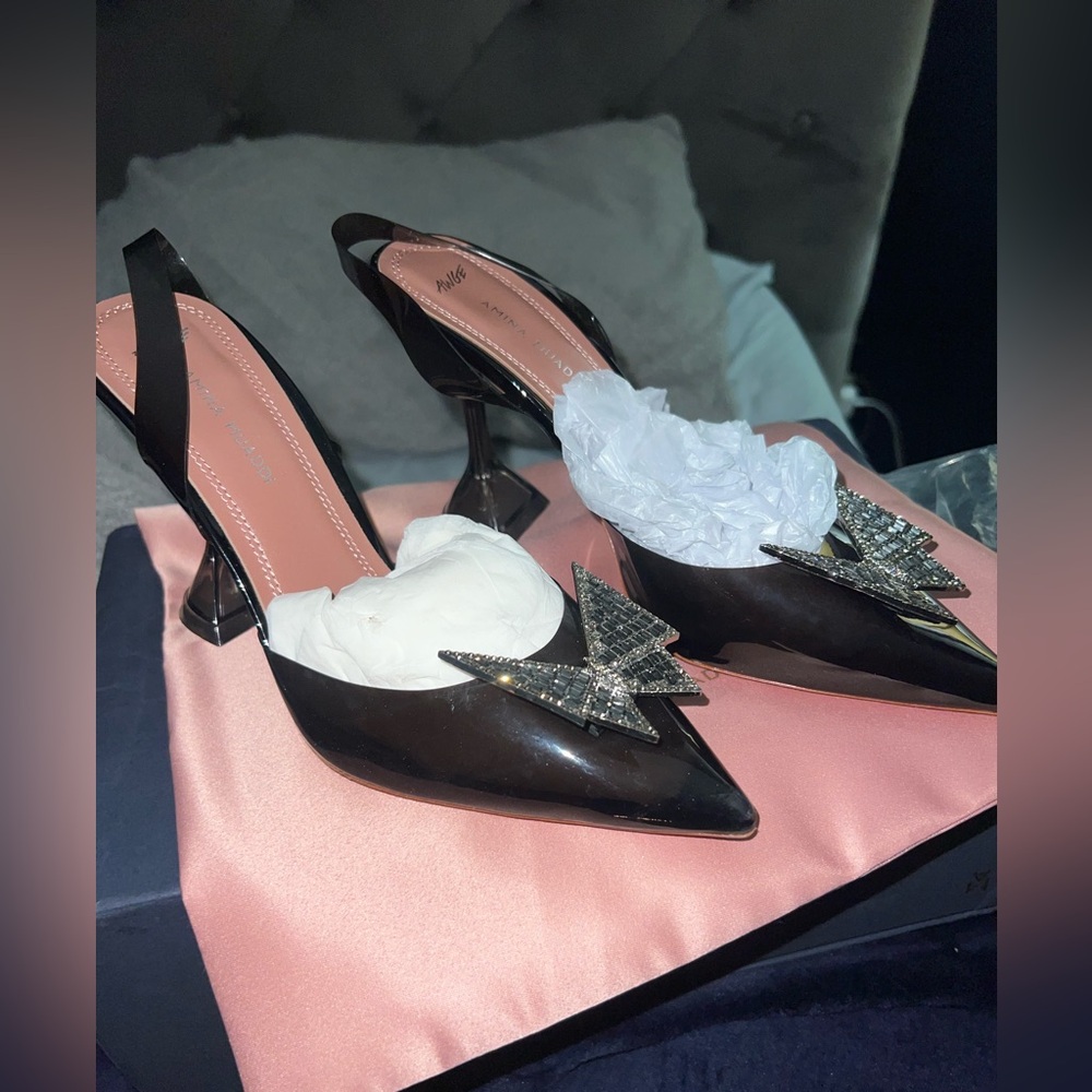 Amina Muaddi Black Patent Slingback Heels with Crystal Star Accents